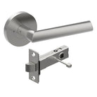 Style Finish Doorware COMO door handle on a door, featuring a sleek satin stainless steel finish and modern design.