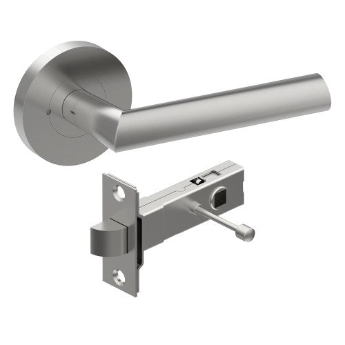 Style Finish Doorware COMO door handle on a door, featuring a sleek satin stainless steel finish and modern design.