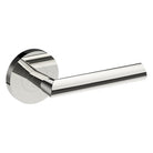 Stainless steel COMO door handle by Style Finish Doorware mounted on a door with a sleek, modern design.