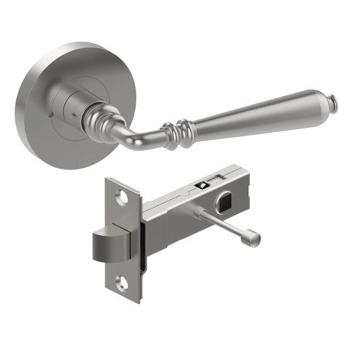 Style Finish Doorware ELEGANTE door handle mounted on a door, showcasing sleek metal design and polished finish.