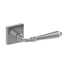 Stainless steel ELEGANTE door handle by Style Finish Doorware mounted on a wooden door, featuring a sleek, modern design