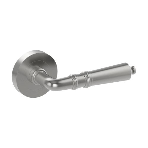Stylish LATINA door handle by Style Finish Doorware, silver finish, modern design, mounted on door with visible latch.