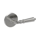 Latina door handle by Style Finish Doorware, sleek stainless steel finish, modern design, mounted on door with visible latch mechanism.