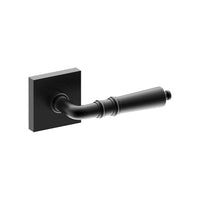 Black LATINA door handle by Style Finish Doorware mounted on a door with a sleek, modern design.
