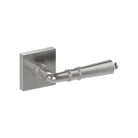 Stainless steel Latina door handle by Style Finish Doorware mounted on a door, featuring sleek modern design with a curved lever.
